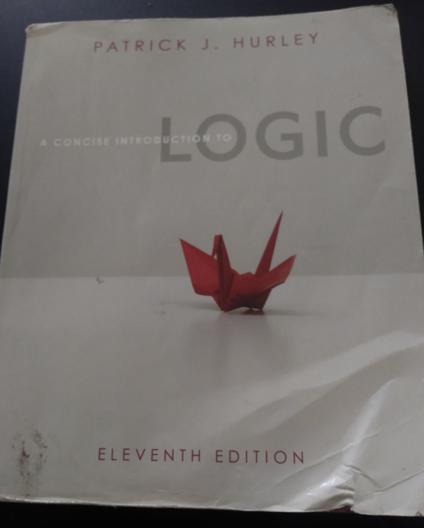 The cover of the book you can use to study for the logic section of the IMAT exam, called "A Concise Introduction to Logic - 11th Edition"